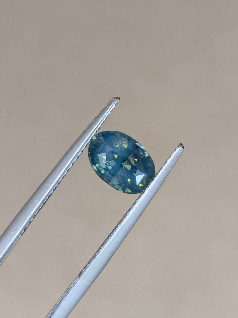 1.64ct Opalescent Teal Sapphire Oval
